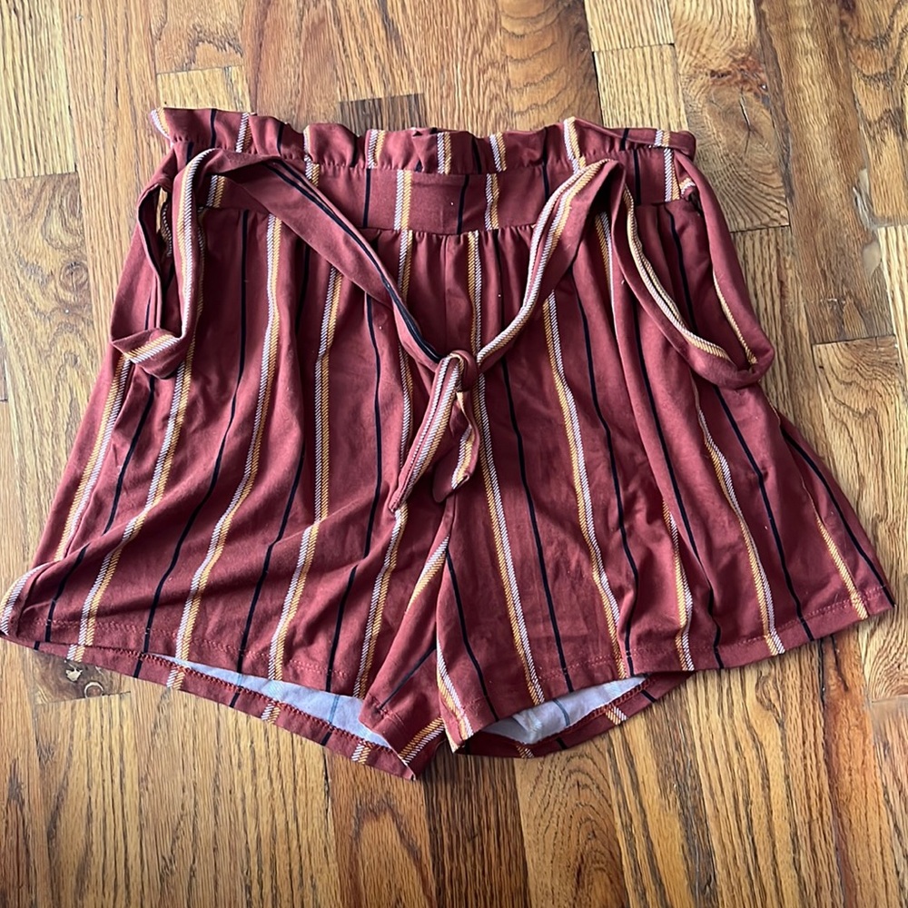 Color is Redish-Orangish, with striped colors of yellow and white